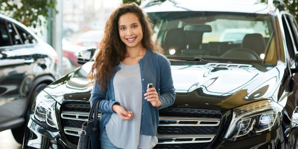 Young woman buying car