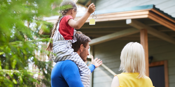 Family in front of new home